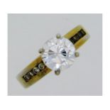 A gold plated silver ring set with CZ stones, size