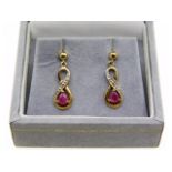 A pair of 9ct gold ruby & diamond earrings, 1g, 16