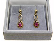 A pair of 9ct gold ruby & diamond earrings, 1g, 16