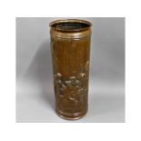 An embossed copper style stick stand, 25.5in high