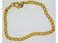 A yellow metal bracelet, tests electronically as 2