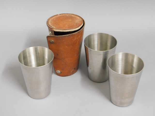 A leather cased travel cup set