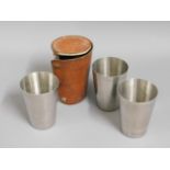 A leather cased travel cup set