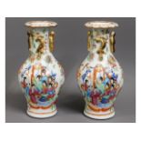 A pair of 19thC. Chinese porcelain vases with figurative decor, one repaired, 9.25in high