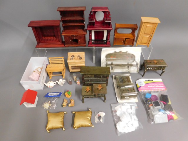 A quantity of dolls house furniture, tallest piece