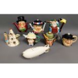 Eight novelty teapots including a Zeppelin & a Che