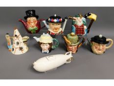 Eight novelty teapots including a Zeppelin & a Che