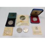 A solid silver Thaler, three crowns & a Royal Mint