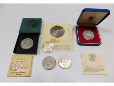 A solid silver Thaler, three crowns & a Royal Mint