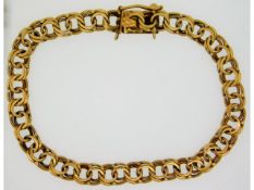 A yellow metal bracelet, foreign marks, tests as 1