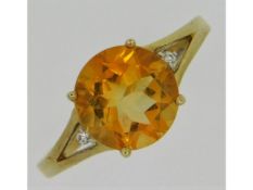 A 9ct gold ring set with citrine & diamond, size O