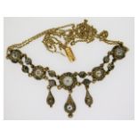 An art deco, 1920's yellow & white metal necklace,