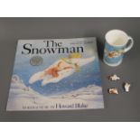 A Snowman vinyl LP twinned with cup & small models