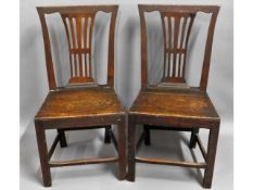 A pair of c.1900 rustic oak hall chairs, 36in high