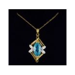 An 18in long 9ct gold chain with diamond & topaz 9