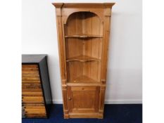 A vintage pine corner display cabinet with cupboar