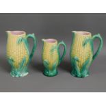 Three c.1900 corn on the cob water jugs, 9in talle