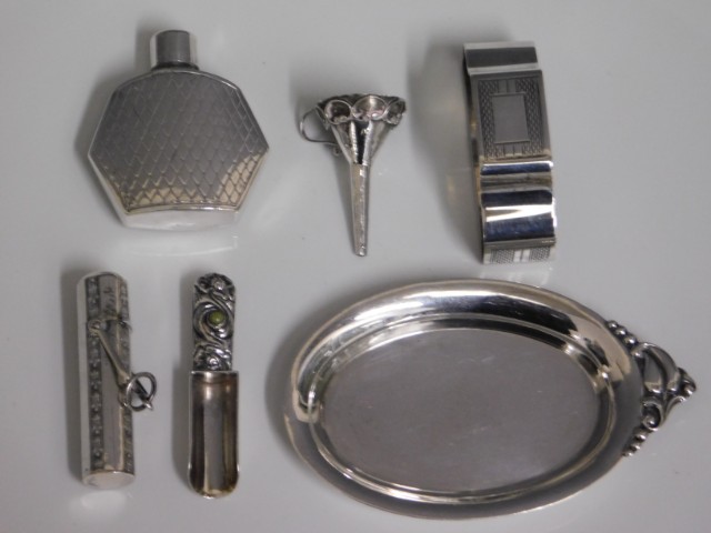 A silver cased scent bottle, an art deco style sil