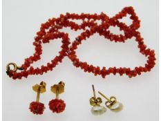A pair of 18ct gold mounted coral screwback earrin