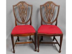 A pair of 19thC. mahogany shield back dining chair