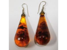 A pair of amber drop earrings, 2in high, 24.7g