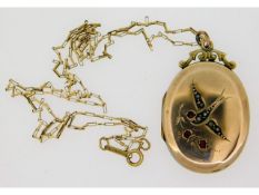 A 9ct gold chain with antique yellow metal locket,