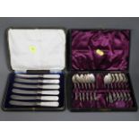 A cased set of silver handled fruit knives twinned