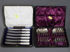 A cased set of silver handled fruit knives twinned