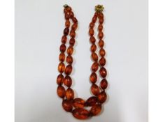 An antique faceted double amber necklace, 51.8g, 1