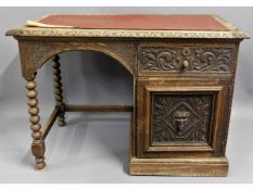 A c.1890 oak green man desk, 42.75in wide x 24in d