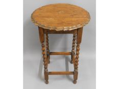 A barley twist oak occasional table, 28.5in high x