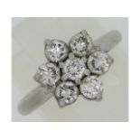 A platinum daisy ring set with 1.06ct of diamonds,