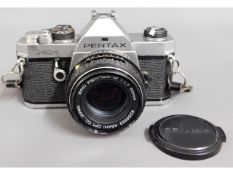 A Pentax MX 35mm film camera with 50mm lens with m