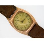 An early 20thC. gents 9ct rose gold wrist watch, a