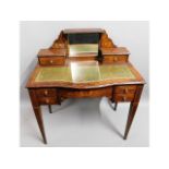 An antique inlaid rosewood desk with mirrored back