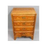 A oak chest of four drawers, 35.25in high x 23in w