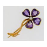 A 15ct gold floral brooch set with amethyst & pear