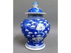 A 19thC. lidded Chinese ginger jar with prunus flo