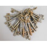 A bunch of antique style door keys