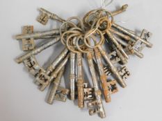 A bunch of antique style door keys