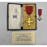 A cased OBE set awarded to T. W. Warburton JP