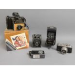 A small selection of vintage cameras: Polaroid Col