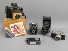 A small selection of vintage cameras: Polaroid Col