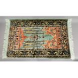 An Islamic silk prayer mat, 45in x 27in