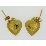 A pair of 9ct gold heart shaped earrings, 0.7g, 18