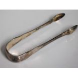 A pair of George III London silver sugar tongs by