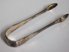 A pair of George III London silver sugar tongs by