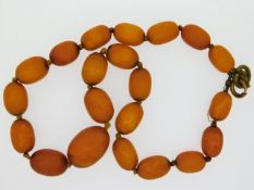 A set of Victorian butterscotch amber beads, 16in