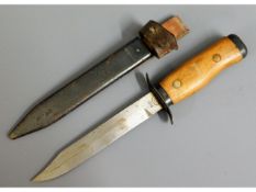 A military dagger & scabbard, blade stamped R07650