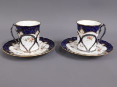 A pair of silver mounted Coalport coffee cups & sa